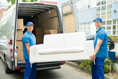 Customer moving boxes carefully along a clear storage aisle