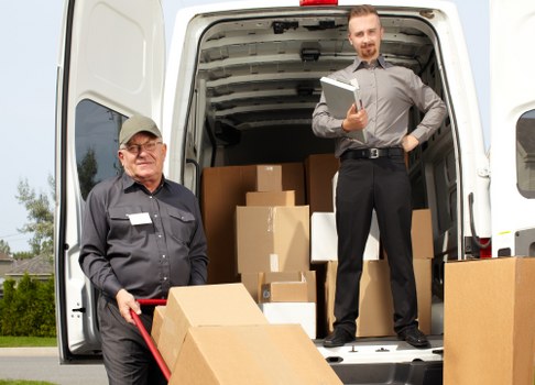 Professional movers handling compact household furniture in Nagshead